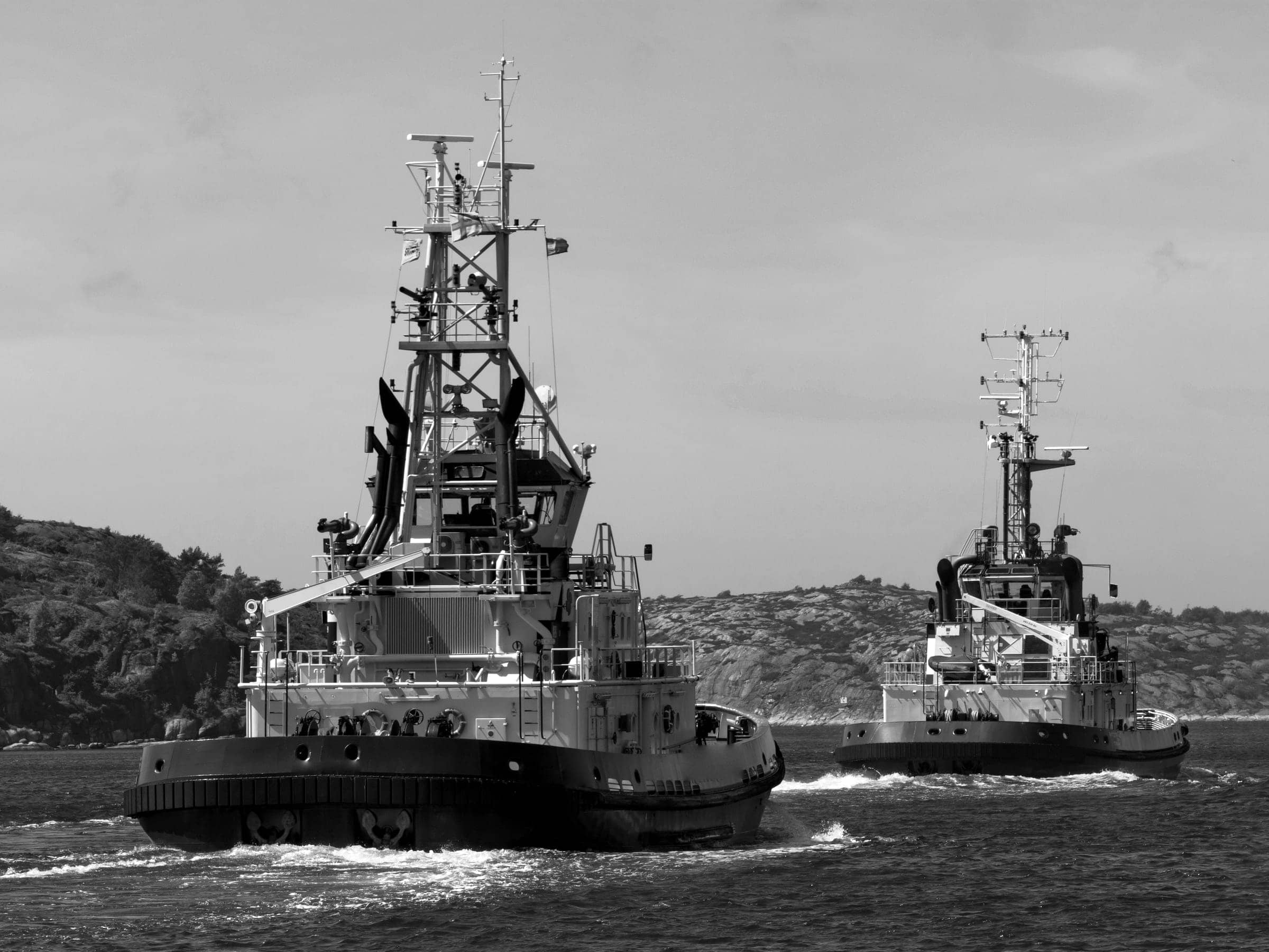 Two harbour tugboats under way