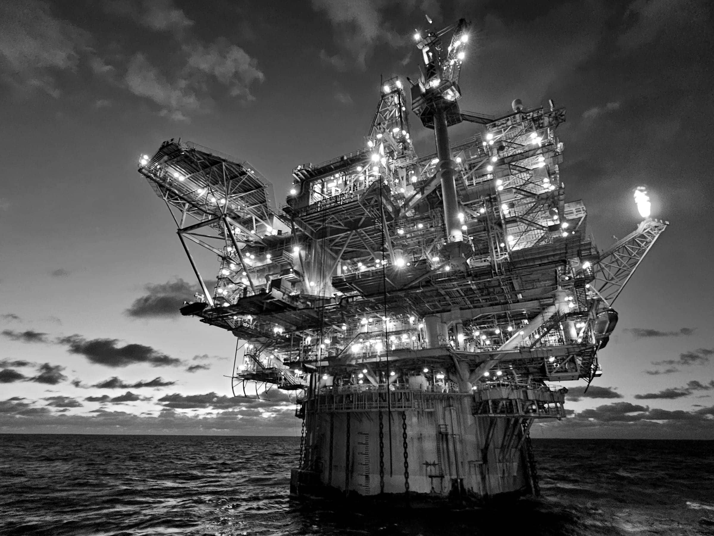 Offshore production platform at dusk